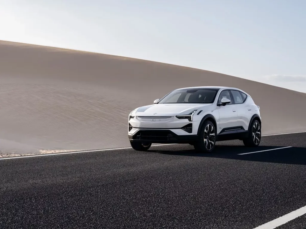 Polestar 3 showcased in a desert scene, with its futuristic white design and clean lines reflecting the electric crossover's performance and style.