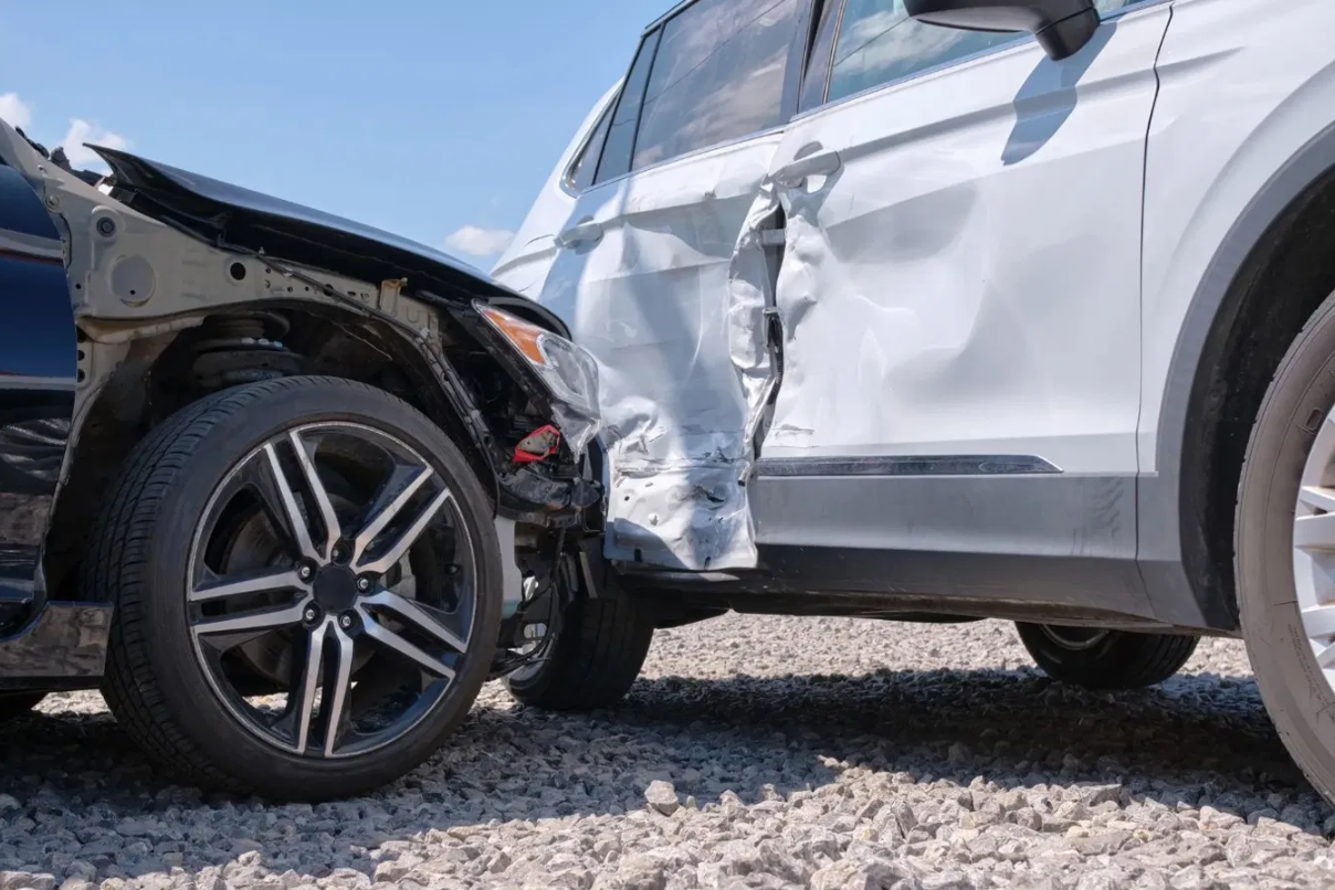 Two SUVs after a side collision showing significant door and panel damage, illustrating diminished value loss for trucks and SUVs in NC and SC